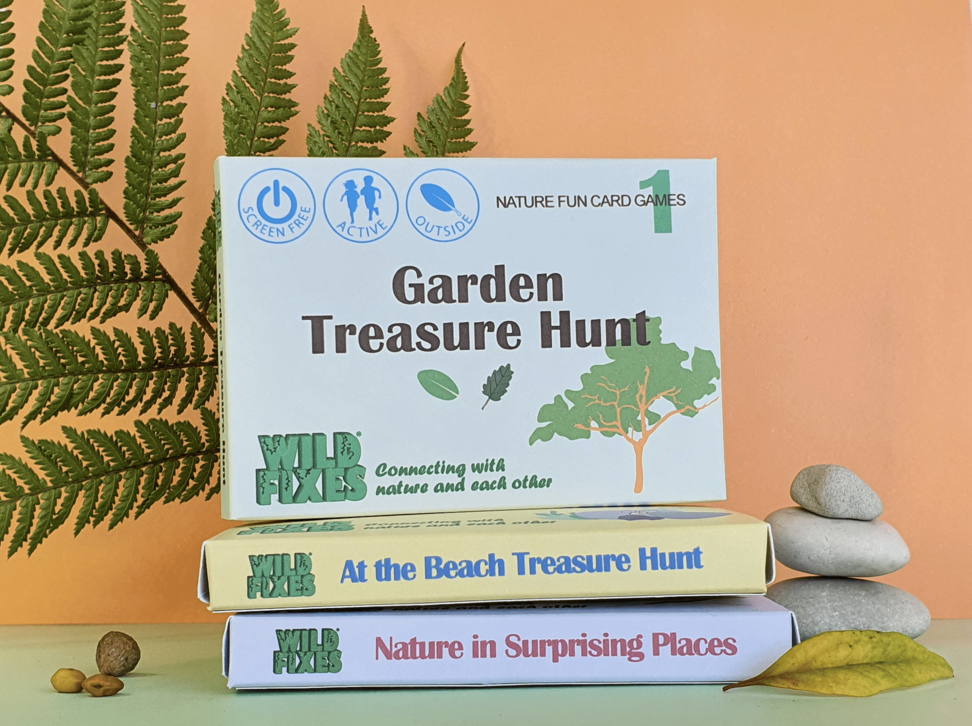 A collection of nature-inspired games stacked on a nature themed table