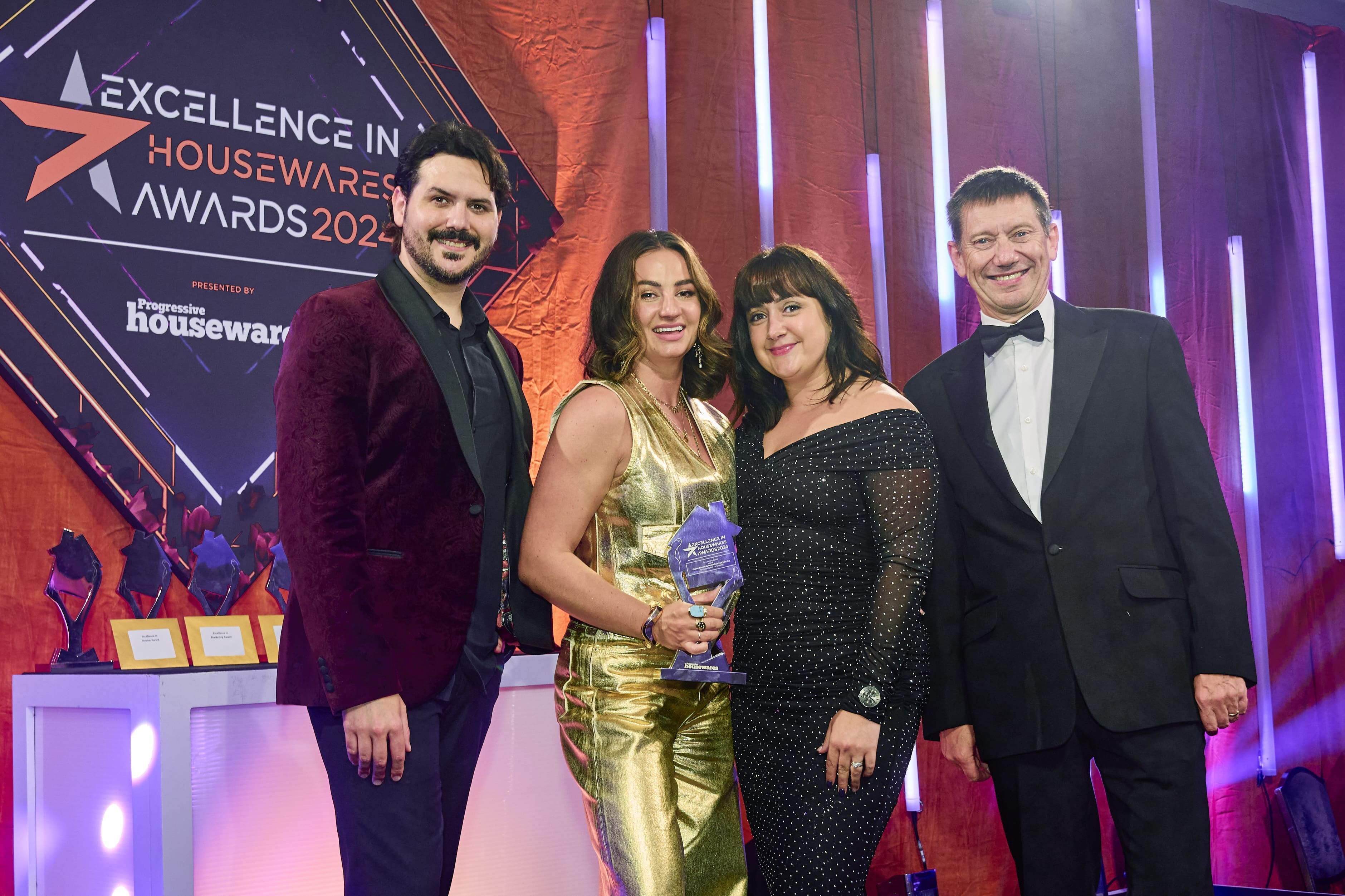 Ignacio Lopez, Eleanor Bowmer, Raven Sprague, Richard Pink on stage receiving award.