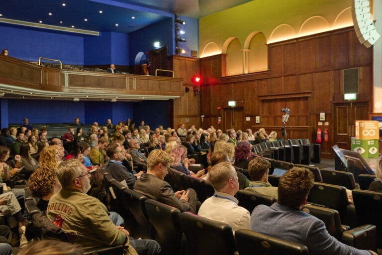 A busy auditorium side angle